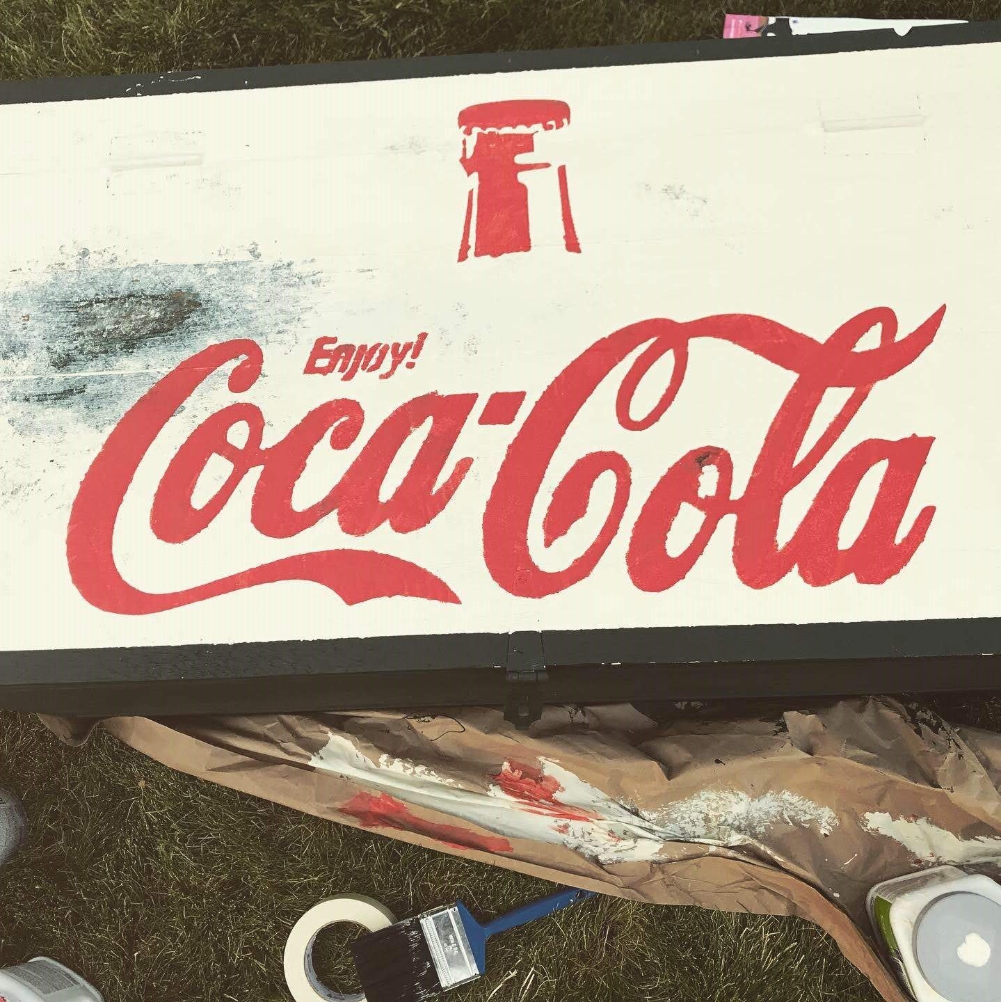 vintage style enjoy coca-cola advertising sign painted on wood