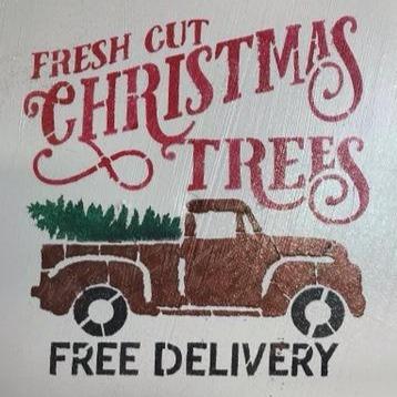 stenciled fresh cut christmas trees loaded on a delivery truck paint on wood